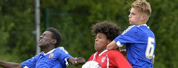 County Down's Leo Brown and Sam Coles of Brentford challenge for possession during Monday's Junior match