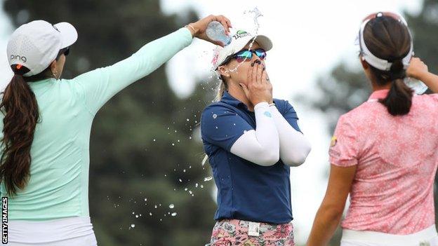 Jodi Ewart Shadoff gets doused in water by fellow players after winning