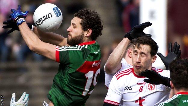 Tyrone's Colm Cavanagh was shown a black card for hauling down Mayo's Tom Parsons