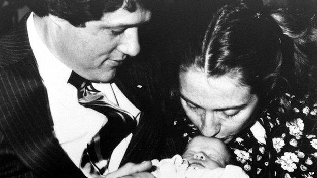 Bill and Hillary Clinton with baby Chelsea in 1980