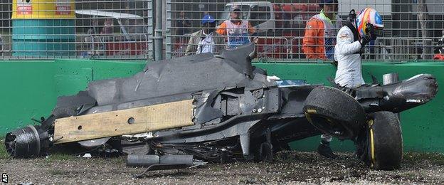 Fernando Alonso walks away from his car