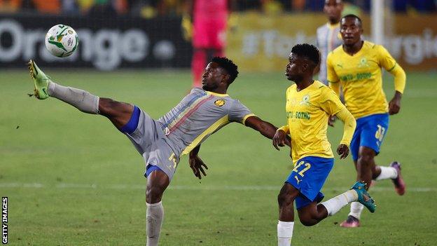 Petro Atletico's Pedro Pessoa Miguel (left) kicks the ball away from Mamelodi Sundowns' Lesedi Kapinga