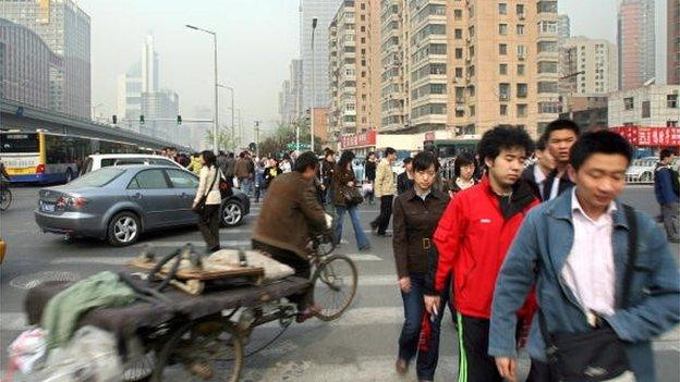 people rushing to work in Beijing