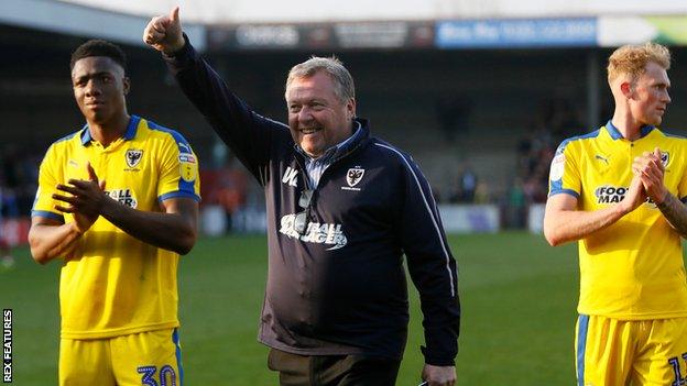 Wally Downes celebrates after AFC Wimbledon's win