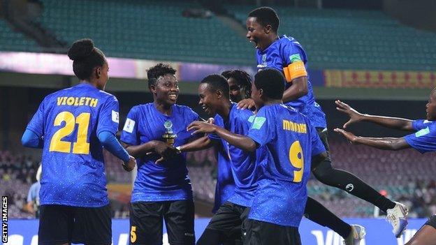 Veronica Mapunda (centre) is mobbed after her crucial equaliser