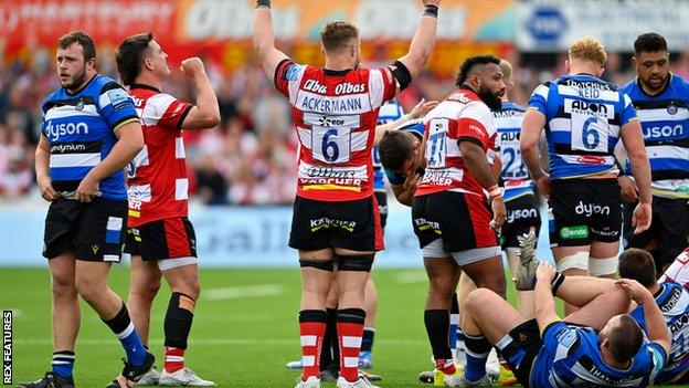 Gloucester players celebrate at the final whistle in their match with Bath in April 2021