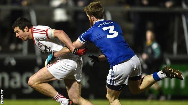 Tyrone's Sean Cavanagh attempts to burst away from Cavan's Rory Dunne in this year's McKenna Cup final