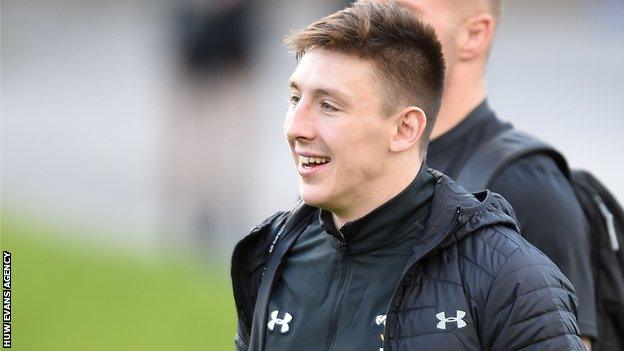 Josh Adams heads to a Wales training session