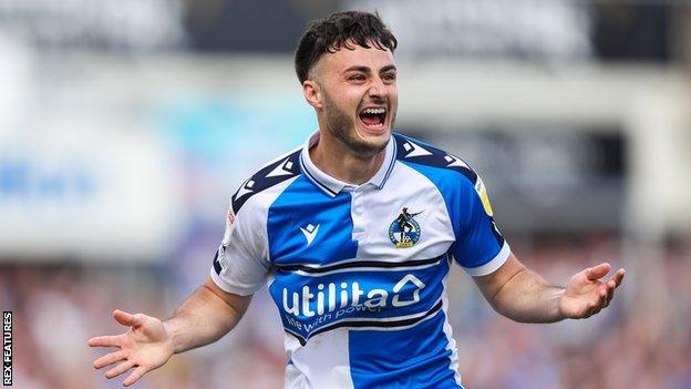 Aaron Collins celebrates scoring Bristol Rovers' sixth goal