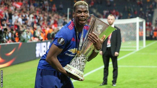 Paul Pogba with the Europa League trophy