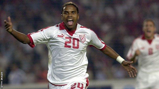 Jose Clayton celebrates a goal for Tunisia in 2006