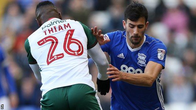 Maxime Colin challenges Barnsley's Mamadou Thiam