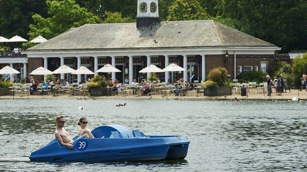 Members of the public enjoy the sunshine in London's Hyde Park on July 1