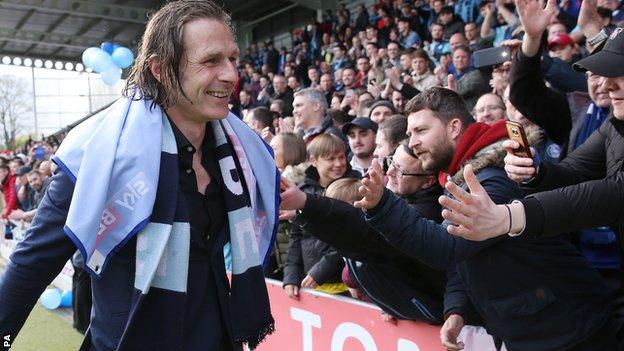 Gareth Ainsworth celebrates League Two promotion with Wycombe fans