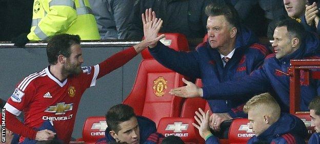 Van Gaal (centre) has a year left on his United contract