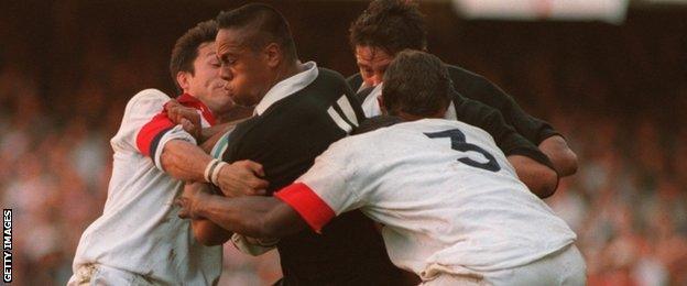 Jonah Lomu charges through England players in the 1995 World Cup