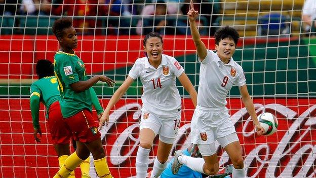 Wang Shanshan (right) celebrates scoring for China against Cameroon