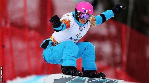 Hernandez in action on the slopes jumping on her snowboard