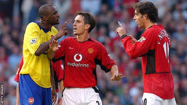 Gary Neville holds Patrick Vieira and Ruud van Nistelrooy apart prior to Vieira being sent off during the FA Barclaycard Premiership match between Manchester United v Arsenal at Old Trafford on September 21, 2003