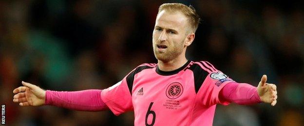 Barry Bannan looks frustrated in Scotland's draw