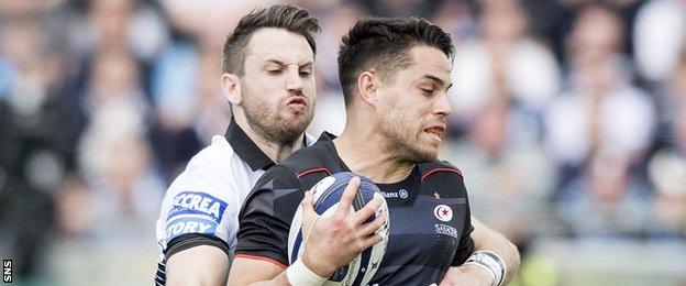 Glasgow's Tommy Seymour tackles Sean Maitland of Saracens