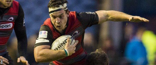 John Hardie carries the ball for Edinburgh against Glasgow