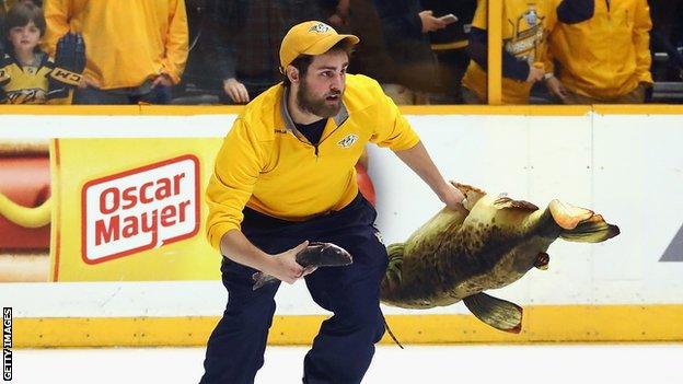 Predators ice crew member clearing catfish