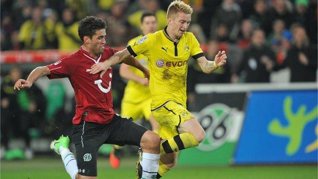 Karim Haggui (left) and Marco Reus