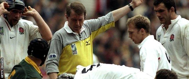 Jim Fleming oversees a scrummage between England and South Africa in the 1999 Rugby World Cup