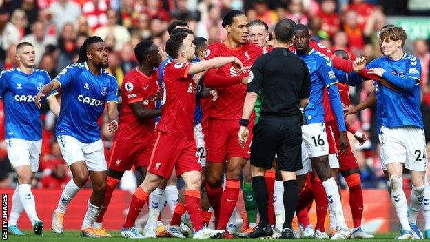 Liverpool and Everton players clash at Anfield