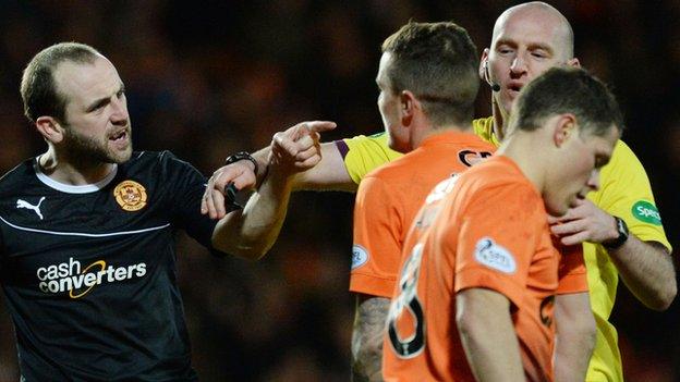 Referee Bobby Madden intervenes as Motherwell's James McFadden argues with Dundee United's John Rankin