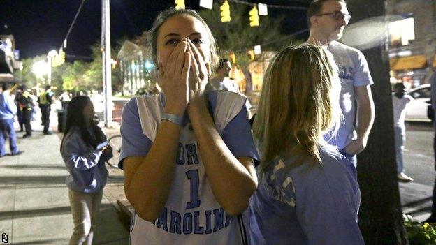 Fans in the streets of North Carolina have contrasting emotions