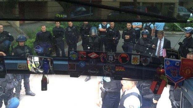 Police wait outside Russia coach