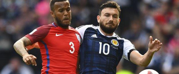 England's Ryan Bertrand and Scotland's Robert Snodgrass