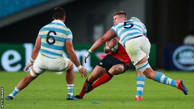 Owen Farrell is tackled by Argentina's Tomas Lavanini