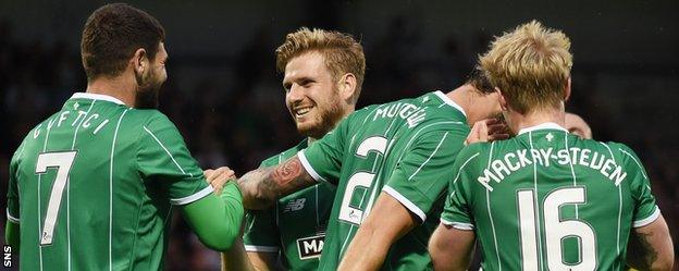 Nadir Ciftci, Stuart Armstrong and Gary Mackay-Steven celebrate with Celtic