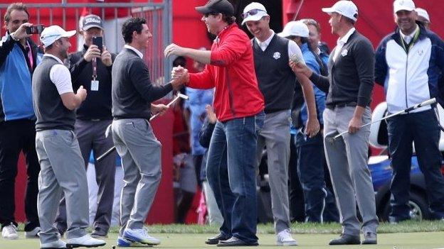 Rory McIlroy congratulates American fan for holing putt