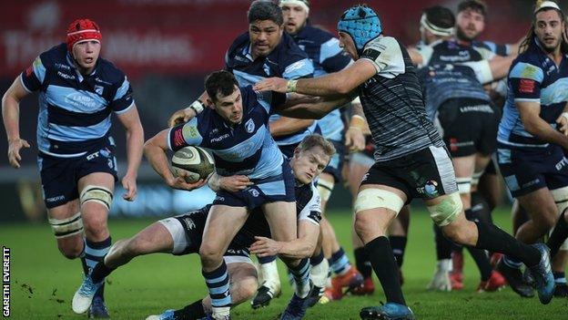 Cardiff Blues' Tomos Williams takes on the Ospreys defence