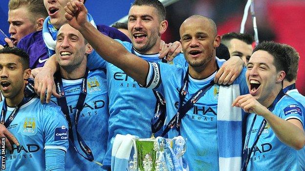 Manchester City players celebrate winning the EFL Cup