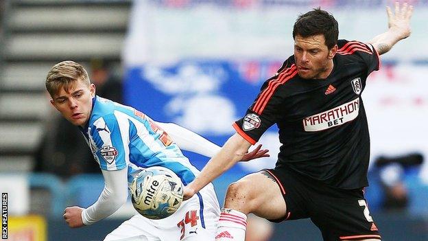 Jake Charles (left) in action for Huddersfield Town against Tim Hoogland of Fulham in 2015