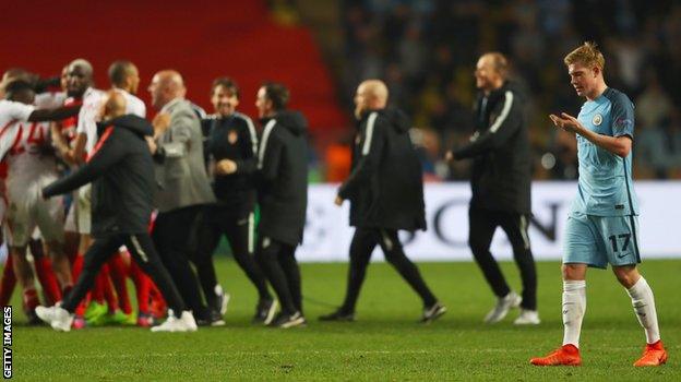 Kevin de Bruyne walks off the pitch as Monaco celebrate