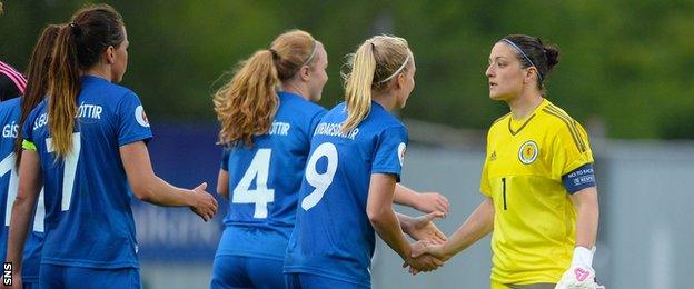 Iceland players shake hands with Scotland's Gemma Fay