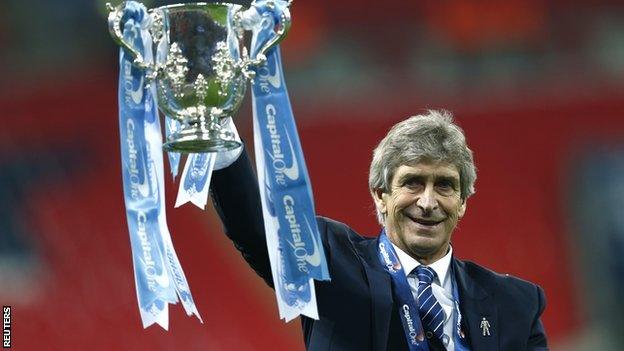 Manuel Pellegrini celebrates winning the Capital One Cup