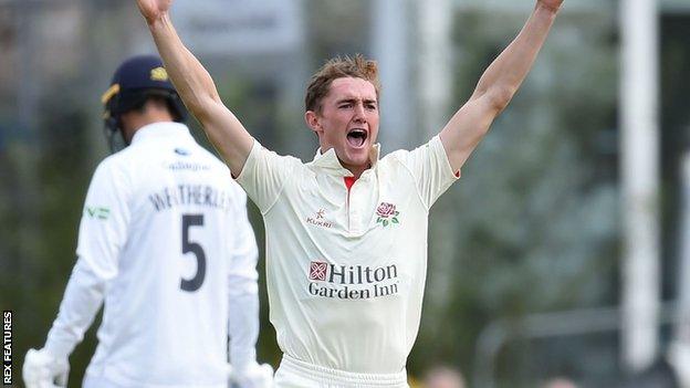 Lancashire's George Balderson celebrates a wicket