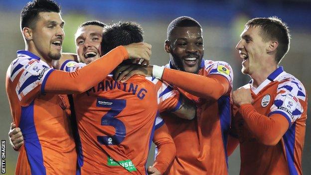 Swansea players congratulate captain Matt Grimes