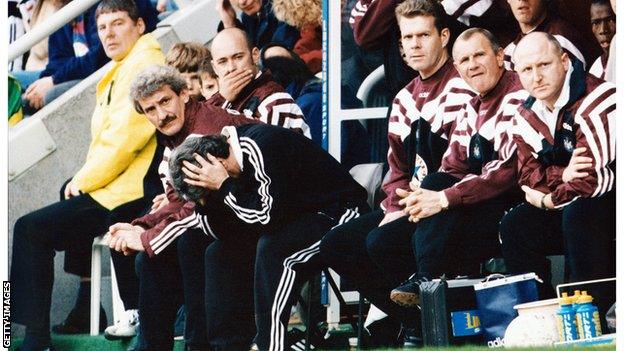 Kevin Keegan with his head in his hands while managing Newcastle in 1996