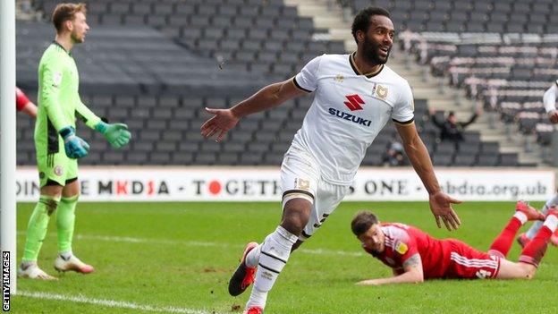 Cameron Jerome scores a goal for MK Dons