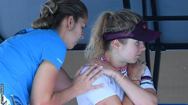 Elina Svitolina receives treatment on her shoulder during her Australian Open loss to Naomi Osaka