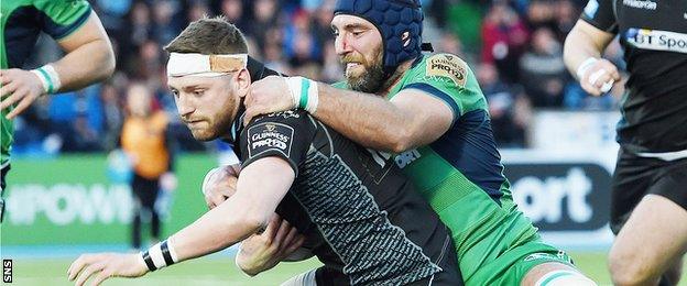 Finn Russell forces his way over to score Glasgow's second try