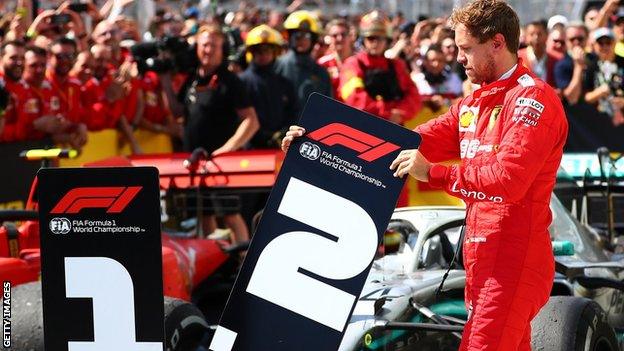 Sebastian Vettel replacing the finish-place markers after the Canadian Grand Prix